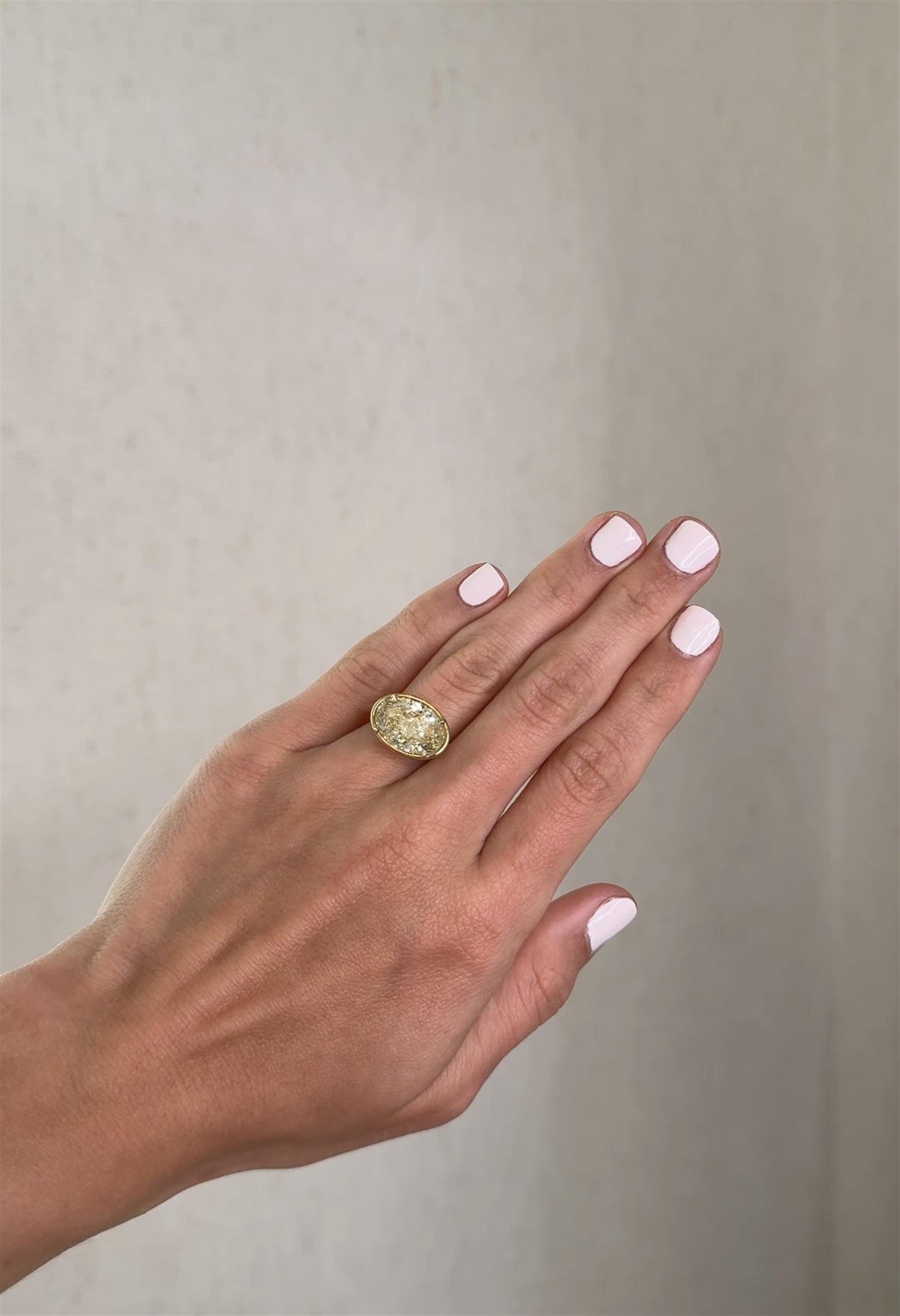 East-West Fancy Light Yellow Oval Solitare
